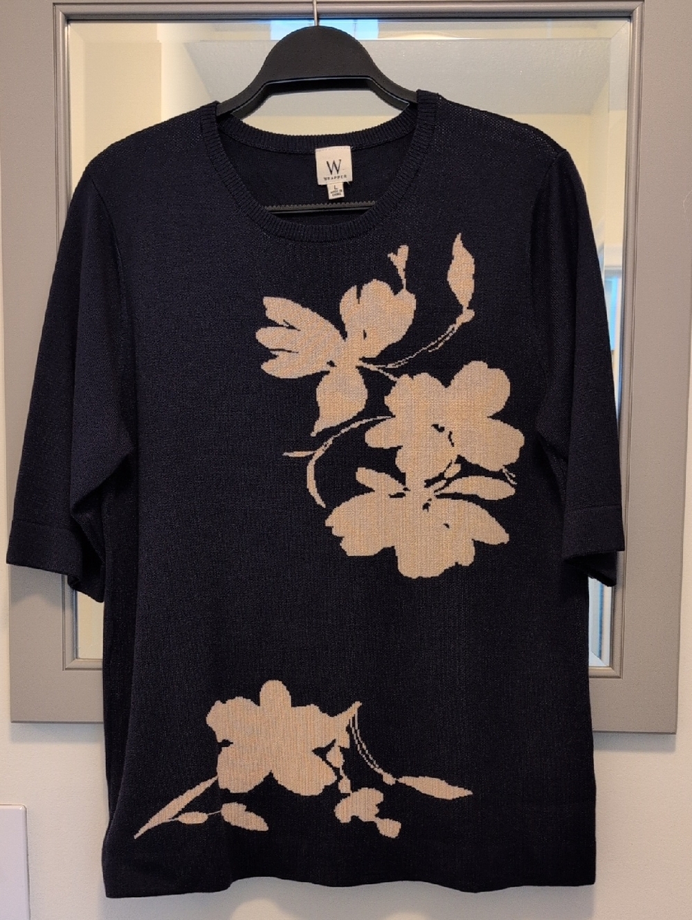 Ladies Size L Soft Navy knit top with beige floral pattern.